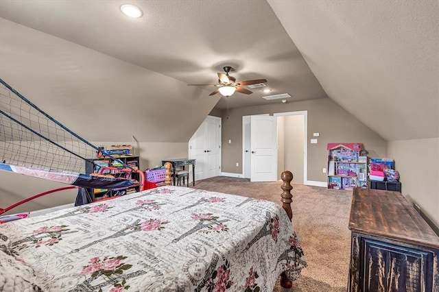 carpeted bedroom with lofted ceiling, a textured ceiling, and ceiling fan