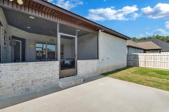 exterior space featuring a patio and a lawn