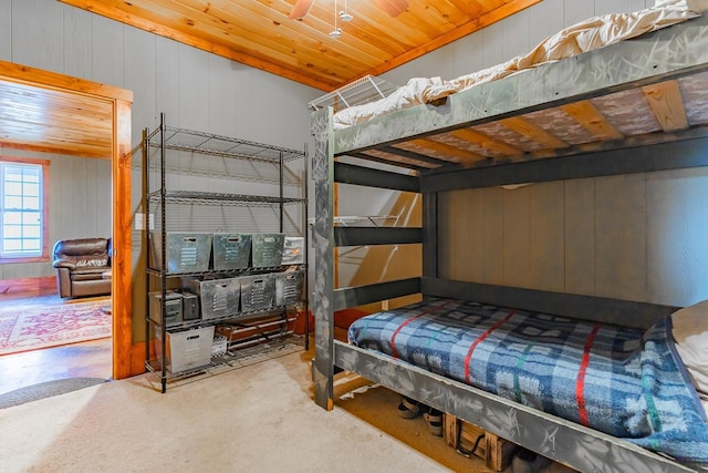 bedroom with carpet floors and wooden ceiling