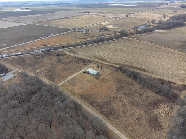 birds eye view of property with a rural view