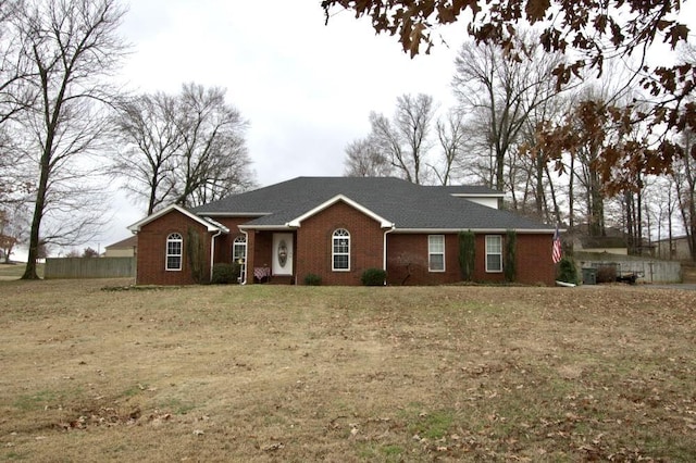 single story home with a front yard