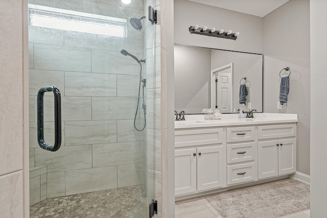 bathroom with vanity and walk in shower