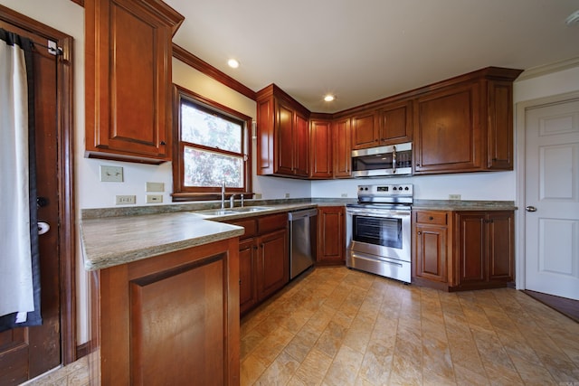 kitchen with crown molding, stainless steel appliances, and sink