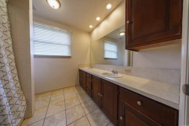 bathroom featuring tile patterned flooring and vanity