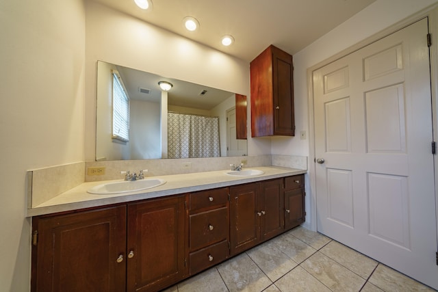 bathroom with vanity and tile patterned flooring