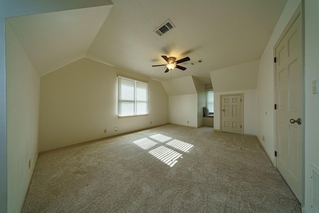 bonus room featuring lofted ceiling, light colored carpet, and ceiling fan