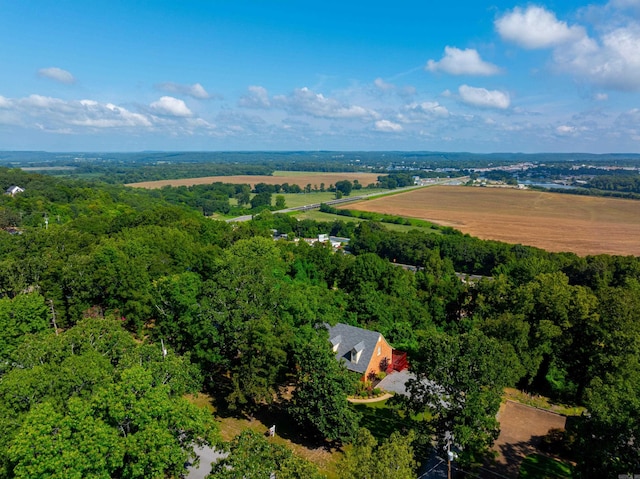 birds eye view of property with a rural view