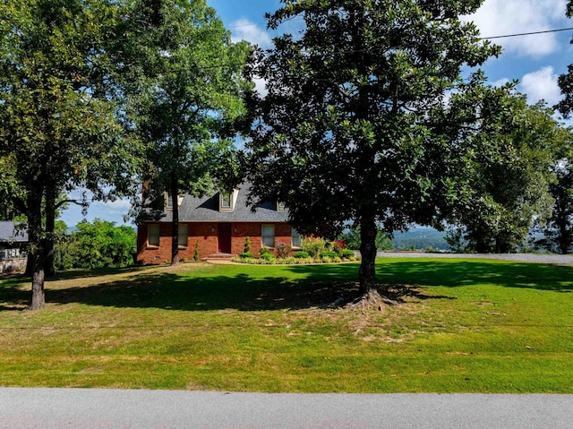 view of front of home with a front yard