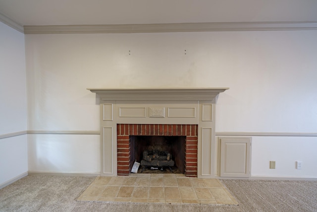 interior details with ornamental molding, a brick fireplace, and carpet