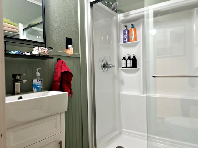 bathroom featuring a shower with door