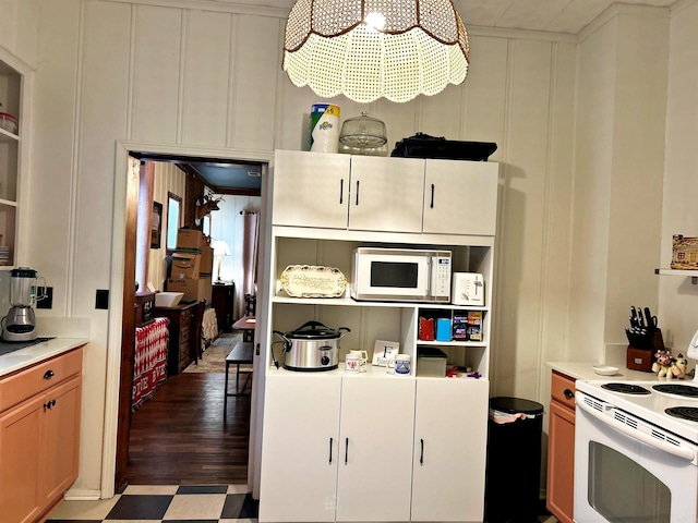 kitchen with white cabinets and white appliances