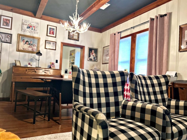 living room with beamed ceiling, wood-type flooring, and a chandelier