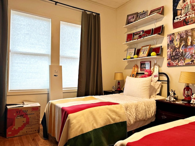 bedroom with wood-type flooring