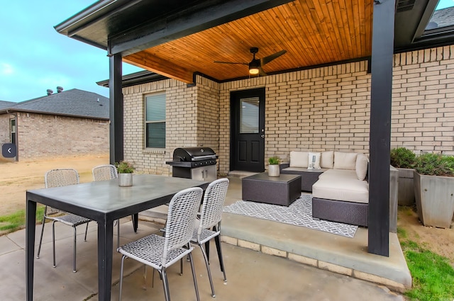 view of patio with ceiling fan, a grill, and an outdoor living space