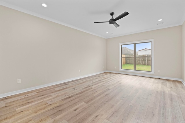 empty room featuring crown molding, ceiling fan, and light hardwood / wood-style floors