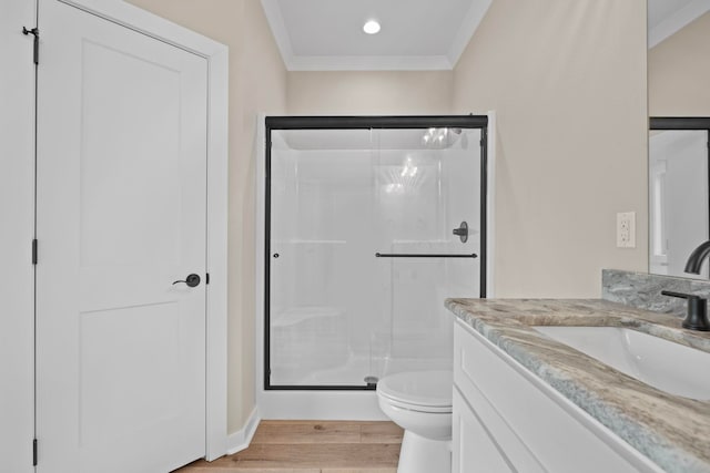 bathroom featuring crown molding, wood-type flooring, and an enclosed shower