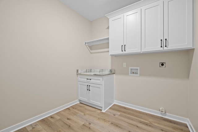 laundry area featuring hookup for a washing machine, cabinets, hookup for an electric dryer, and light hardwood / wood-style floors