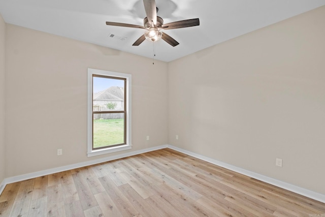 unfurnished room with ceiling fan and light wood-type flooring