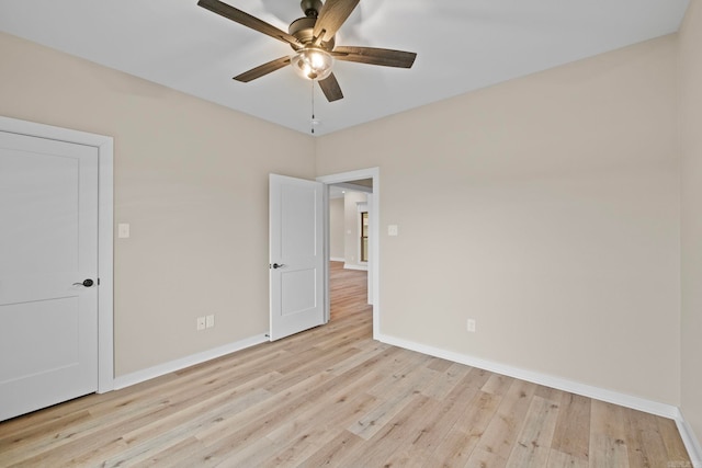 unfurnished bedroom featuring ceiling fan and light wood-type flooring