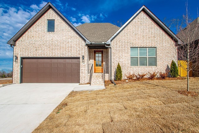 view of front of home with a garage and a front yard