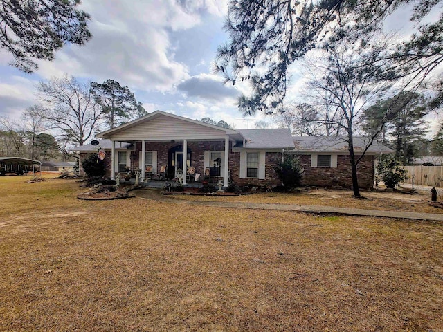 view of front facade with a front lawn and covered porch