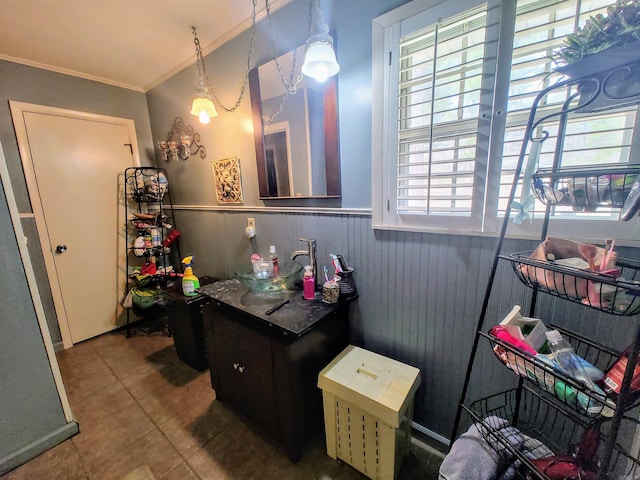bathroom with tile patterned flooring and crown molding