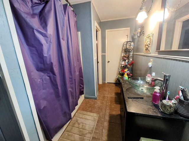 bathroom featuring ornamental molding, vanity, and tile patterned flooring