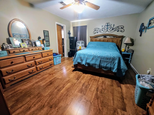 bedroom featuring wood-type flooring and ceiling fan