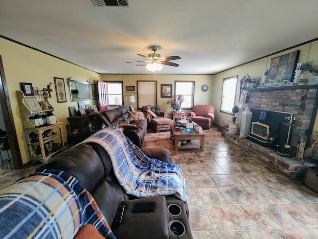 living room featuring crown molding, ceiling fan, and tile patterned flooring