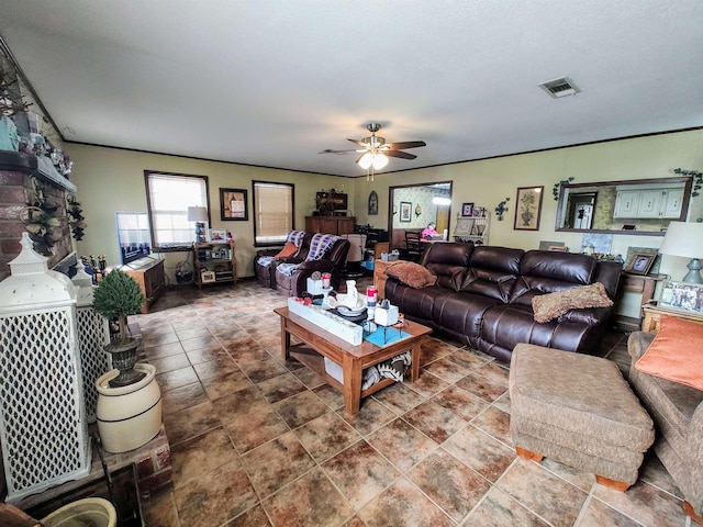 living room featuring tile patterned flooring and ceiling fan