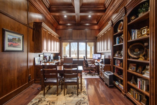 office with dark hardwood / wood-style flooring, crown molding, built in desk, and wood walls