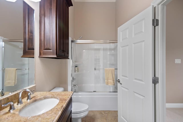 full bathroom with toilet, tile patterned floors, bath / shower combo with glass door, and vanity