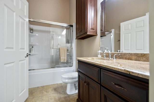 full bathroom featuring bath / shower combo with glass door, toilet, tile patterned floors, and vanity