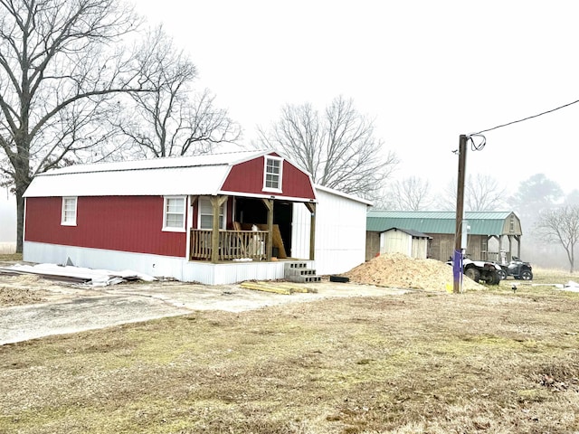 view of outdoor structure featuring a lawn