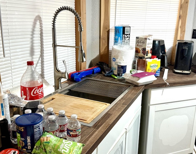 kitchen featuring white cabinets