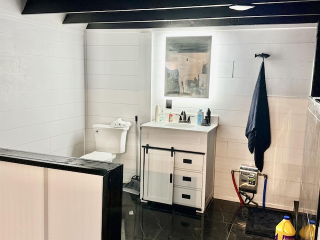 bathroom with vanity and toilet