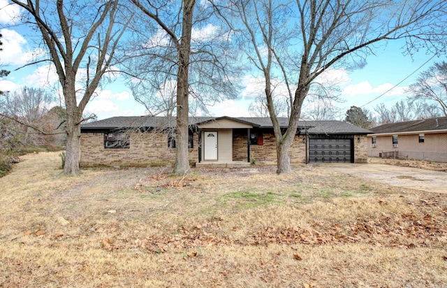 ranch-style home featuring a garage