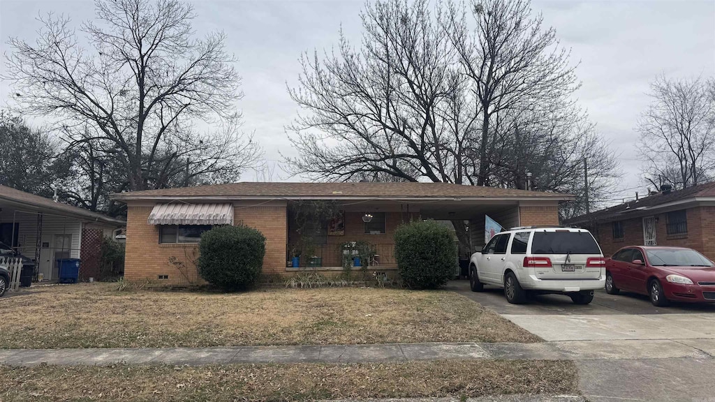 view of front of property with a carport