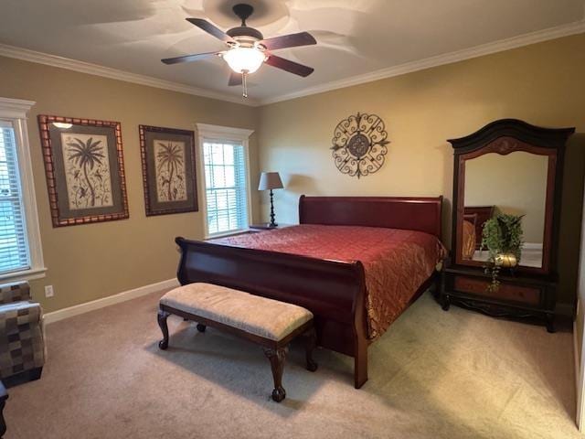 bedroom with ornamental molding, ceiling fan, and carpet