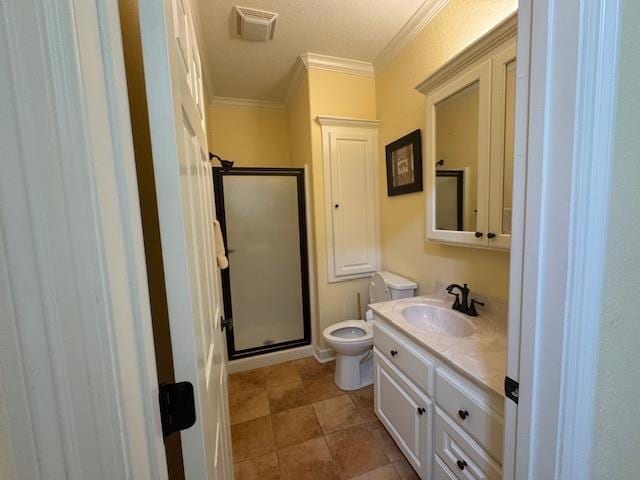 bathroom featuring vanity, a shower with shower door, ornamental molding, and toilet