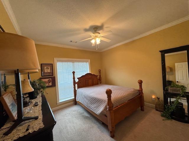 bedroom featuring crown molding and light colored carpet