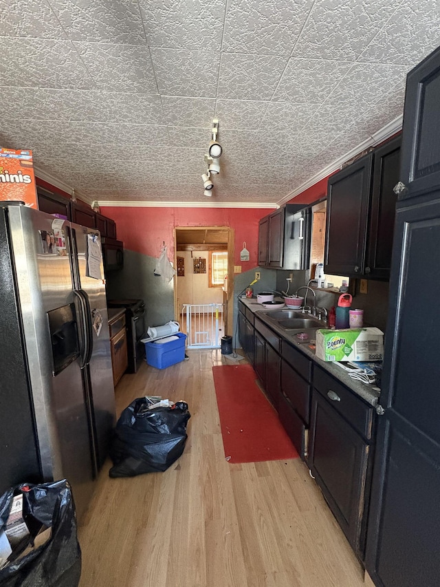 kitchen with ornamental molding, sink, stainless steel fridge with ice dispenser, and light wood-type flooring