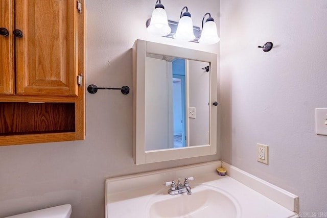 bathroom featuring toilet and sink