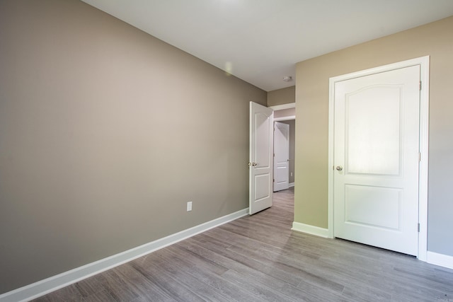 unfurnished bedroom featuring light hardwood / wood-style flooring