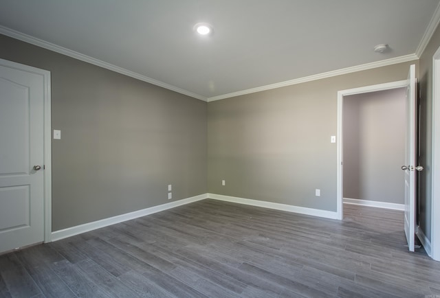 unfurnished room with crown molding and wood-type flooring