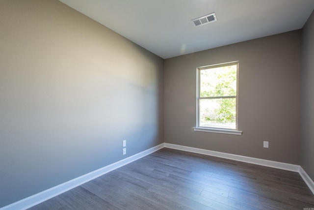 empty room featuring dark hardwood / wood-style floors