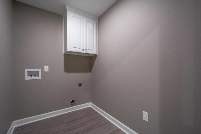 laundry area with dark wood-type flooring, cabinets, washer hookup, and electric dryer hookup