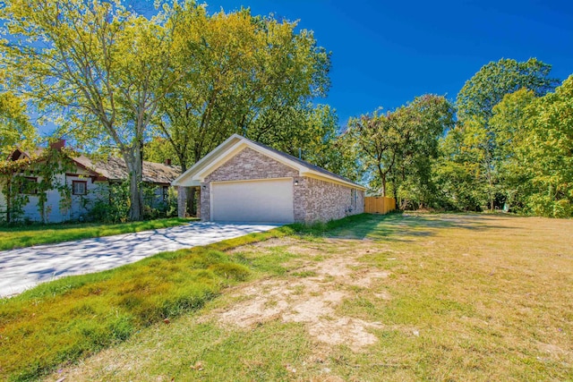 view of property exterior featuring a garage and a yard