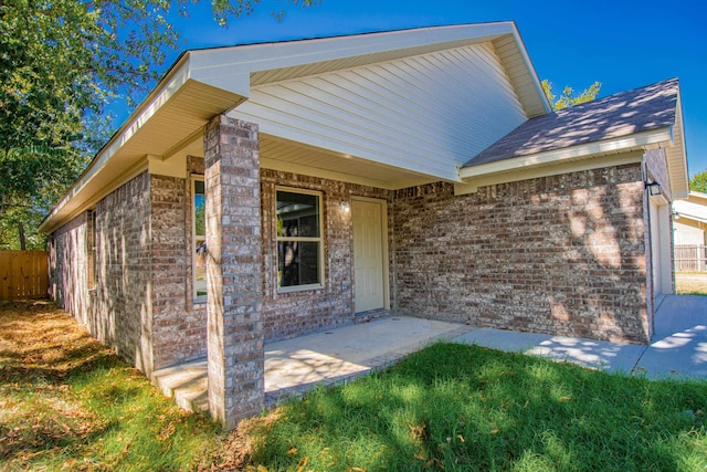 entrance to property featuring a patio area