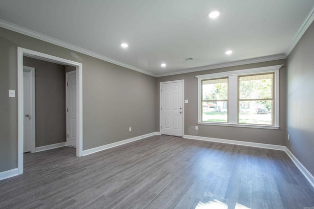 unfurnished room with dark hardwood / wood-style flooring and ornamental molding